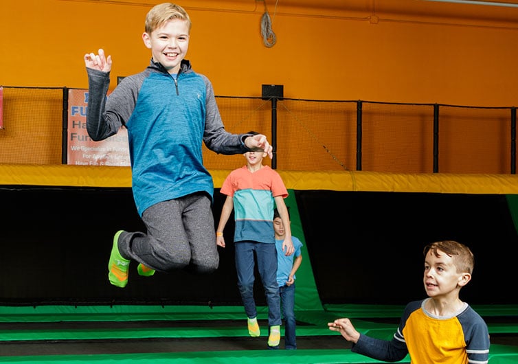 Kids Jumping On Trampoline