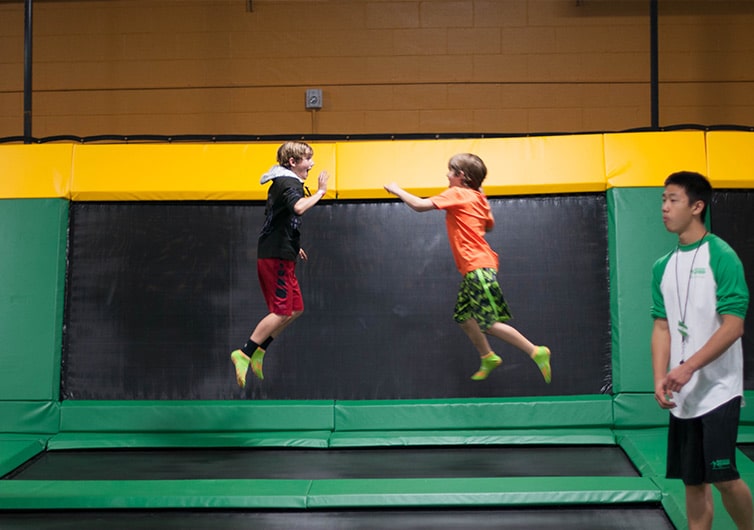 Kids Jumping High Five